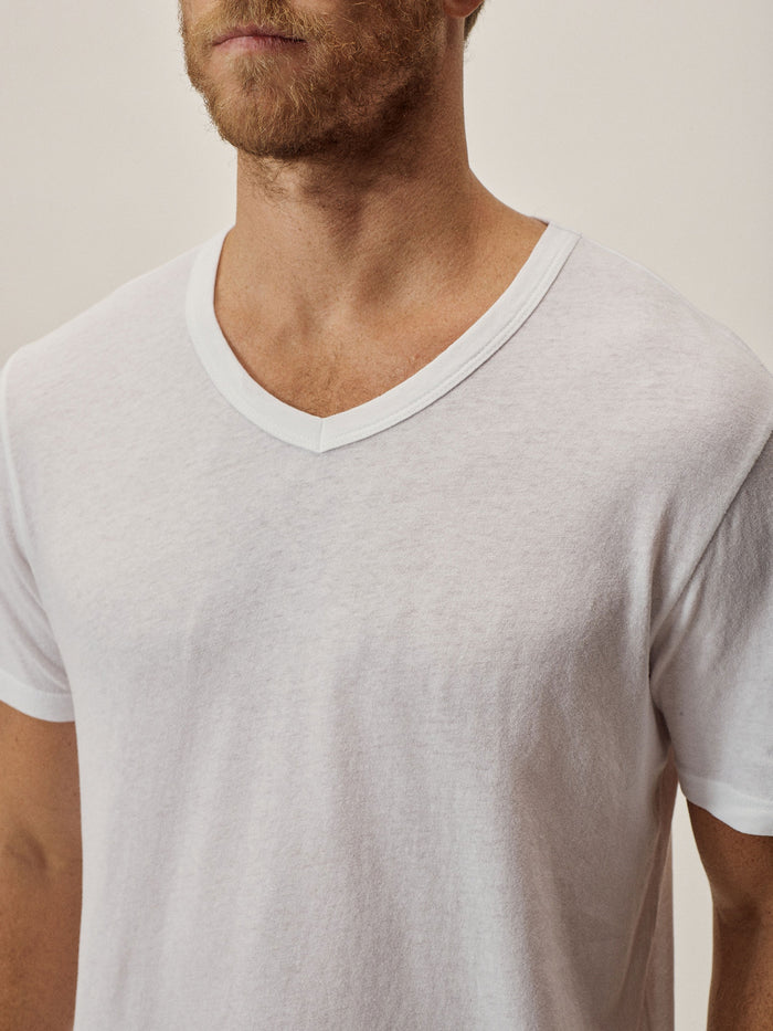 Model Wearing White Costa Curved Hem V-Neck Tee