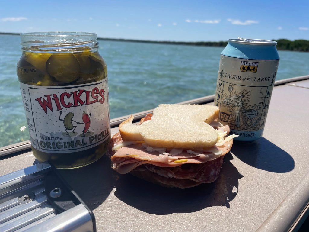 beer, sandwich and pickles on lake michigan