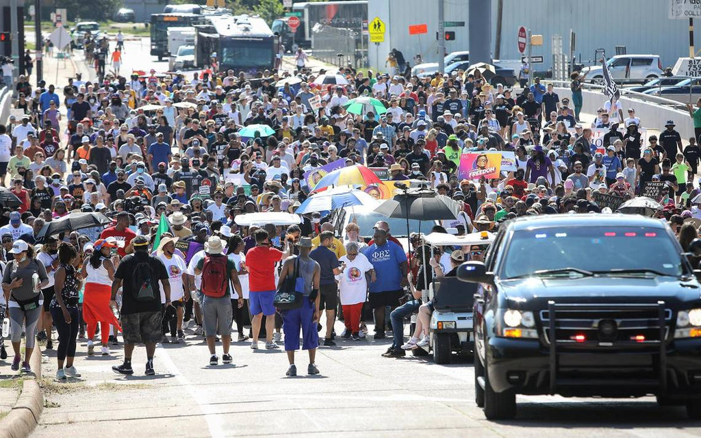 Opal Lee, 94, and hundreds of others walk towards downtown Fort Worth from Evans Avenue Plaza during the first national Juneteenth holiday on June 19, 2021