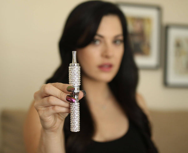 Olivia Alexander holding a vape from The Crystal Cut