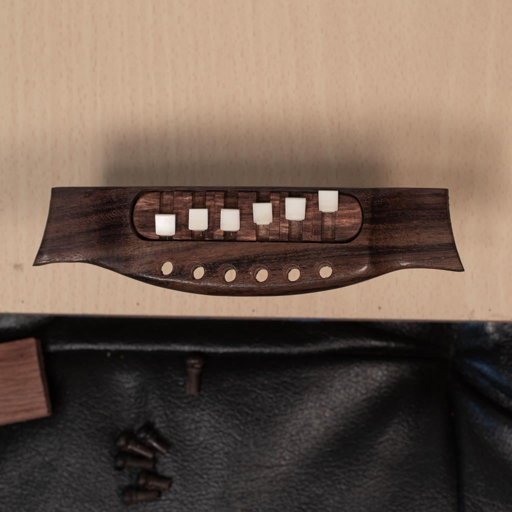 a split saddle acoustic guitar bridge to adjust guitar intonation