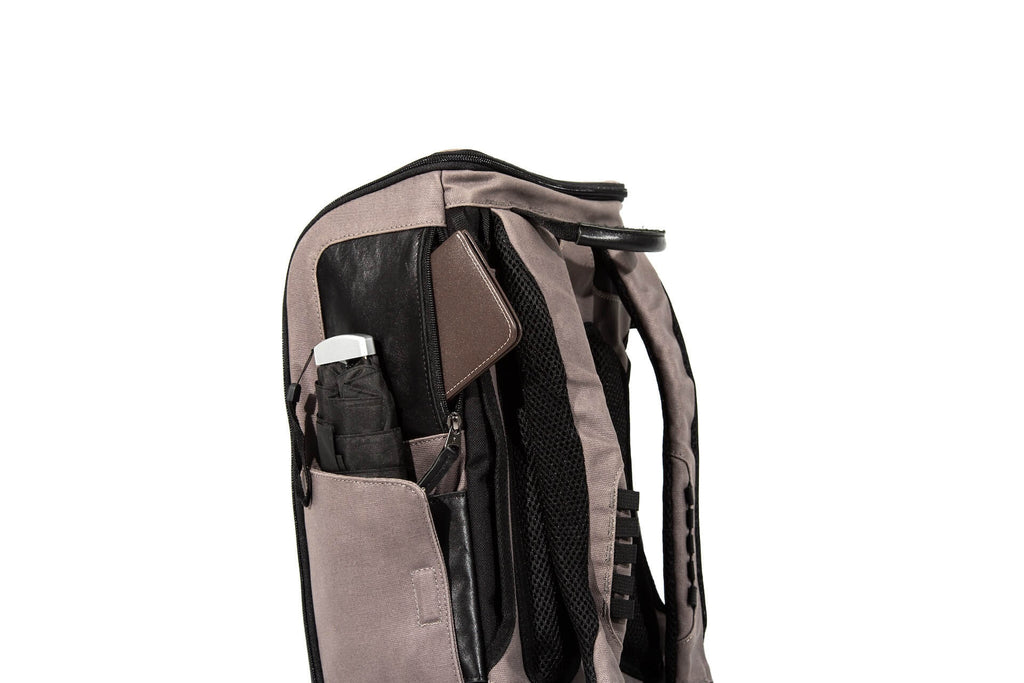 A gray backpack with pockets