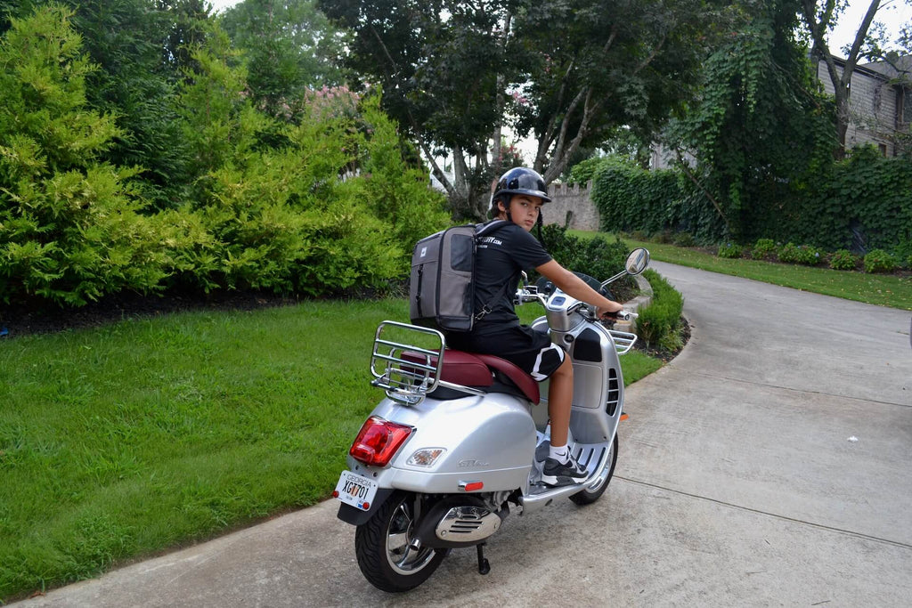  A boy sitting on a motorcycle