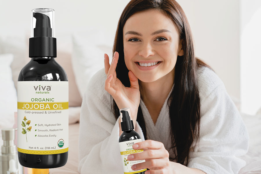 woman holding jojoba oil