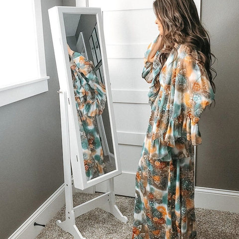 A woman in front of her White Jewelry Armoire