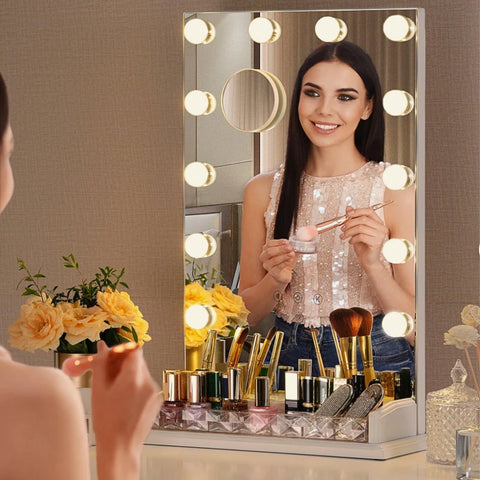 A beautiful putting her blush on in front of LUXFURNI Makeup Mirror with Built-in Storage