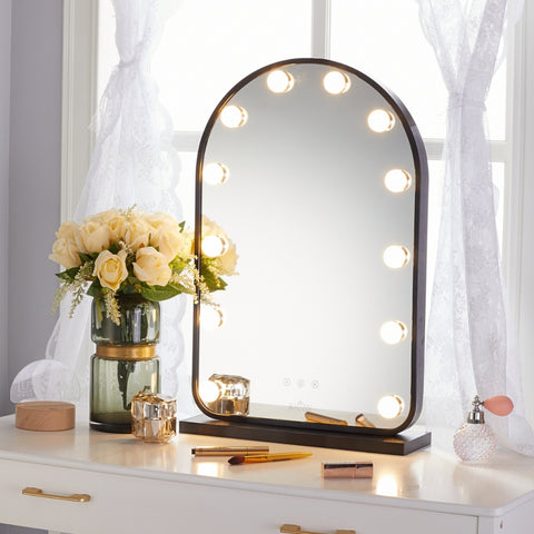 LUXFURNI Starry 12 Curved Frame Hollywood Vanity Mirror on a table
