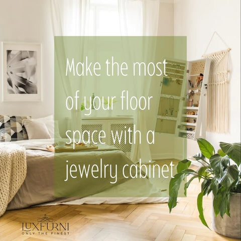 A bedroom with a contemporary design, featuring a white jewelry cabinet with a full-length mirror and a black frame. The cabinet is positioned next to a bed with a white comforter and patterned pillows. A black and white patterned rug sits on the wooden floor beneath the bed.