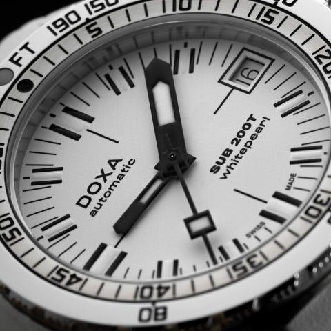 Doxa Sub 200T watch featuring a sleek design with a White dial, luminous markers, and a rotating bezel.