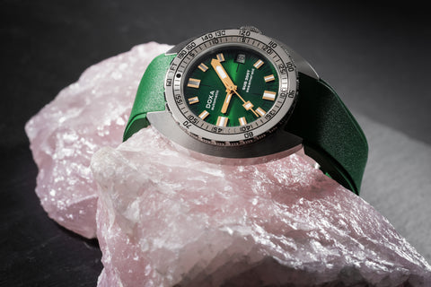 Doxa Sub 200T watch featuring a sleek design with a Green dial, luminous markers, and a rotating bezel.