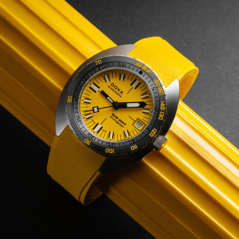 Doxa Sub 200T watch featuring a sleek design with a Yellow dial, luminous markers, and a rotating bezel.