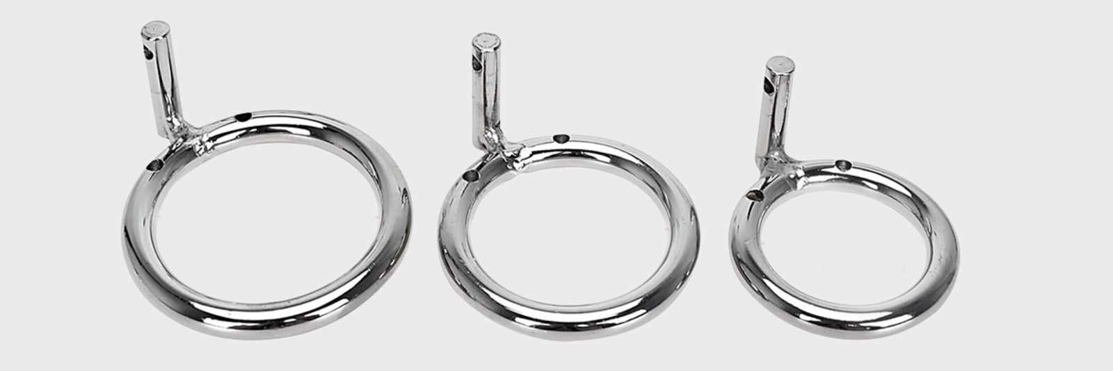 Steel rings that are used for male chastity cages.  These rings are different sizes to make sure they fit everyone.