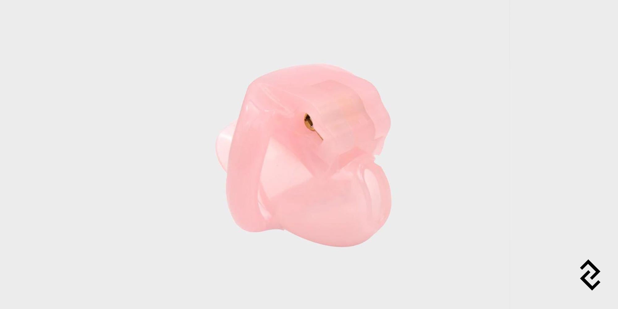 A popular small pink chastity cage called The Nub.