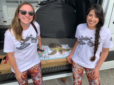 Jaclyn and Yasmin with the sea turtle named Greene Bean who was getting ready to be released back to the ocean.