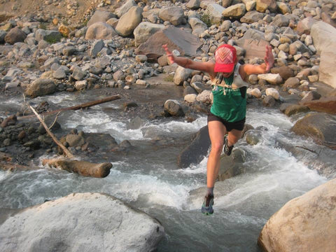 Jameson Clover jumping across a river