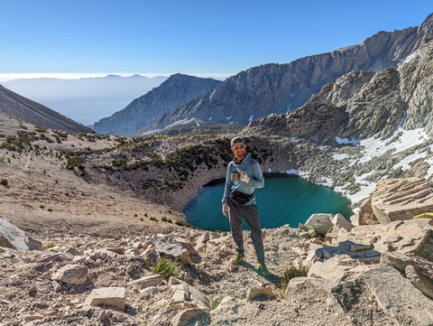 Josh Sheets over an alpine lake