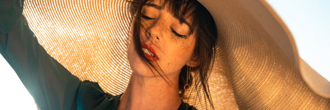 Woman wearing a wide-brimmed sun hat
