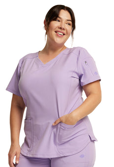 Dickies Dynamix Nurse Scrub Top is made from a high tech poly-spandex fabric blend contructed in a lightweight dobby fabric.  It has lots of pockets to fit all those nursing tools and tech. It is designed to be form flattering, comfort and maximum and durability.