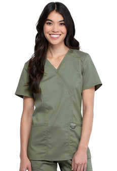Nurse scrub top in colour Olive by Cherokee WW Revolution. It's a mock wrap with front yokes and back princess seams and side vents.