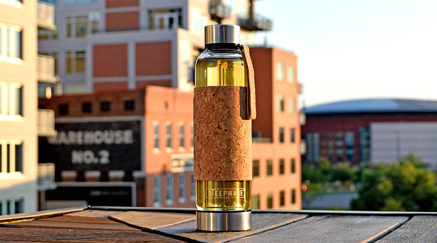 a glass tea tumbler sits on a rooftop