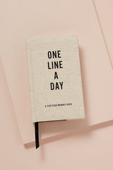 One Line a Day notebook - Beige notebook cover on a peach background