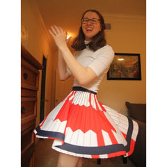 Erin clapping and twirling to show off the Mars 2020 parachute skirt