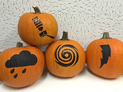 Four pumpkins with weather-themed graphics on them in black, on a white textured background