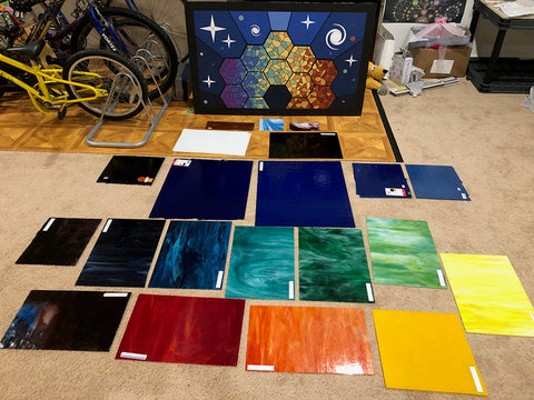 Rectangles of different colors of glass with the design image in the background