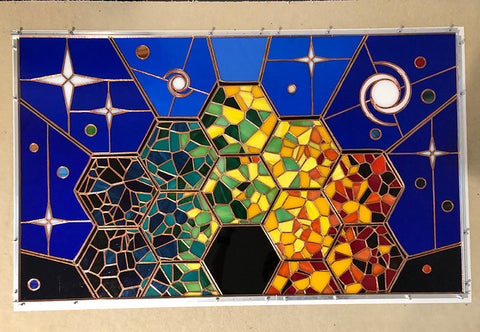 Fully assembled design of the stained glass on a table