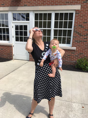 Emily viewing the partial eclipse through eclipse glasses on August 21, 2017