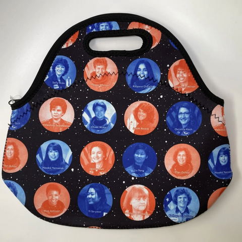 A black lunch tote with orange and blue images of women in STEM