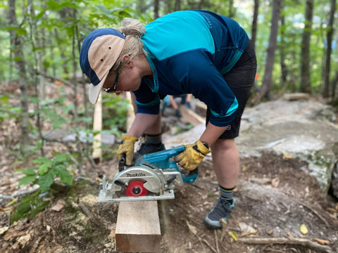 Kenzie Fuqua, wearing the Pinner Mountain bike shorts from Kaden Apparel, plus the 5-panel camp hat