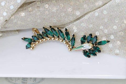 emerald earrings on ear