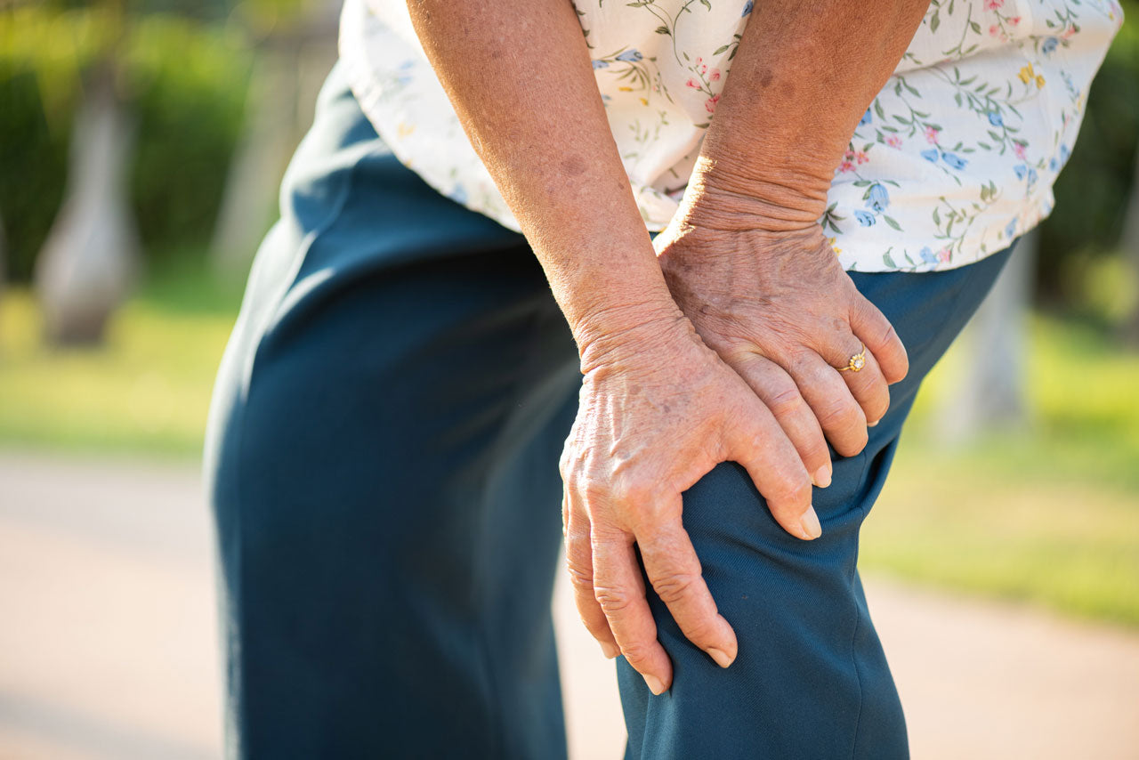 senior suffering arthritis joint pain on the knee