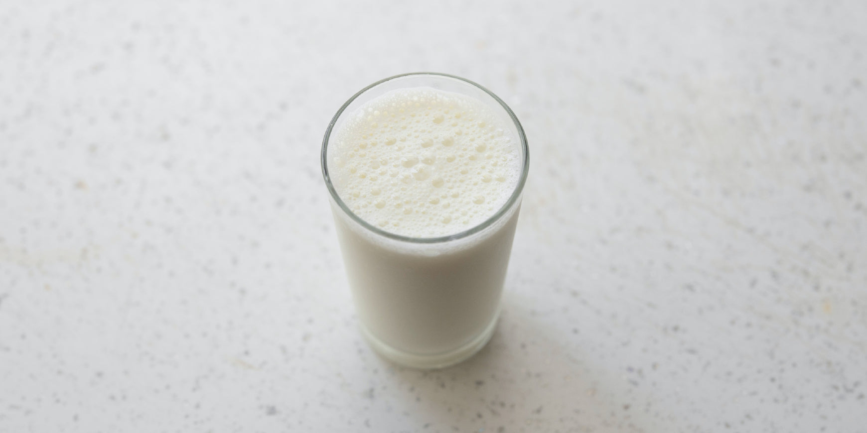 Glass of milk on marble