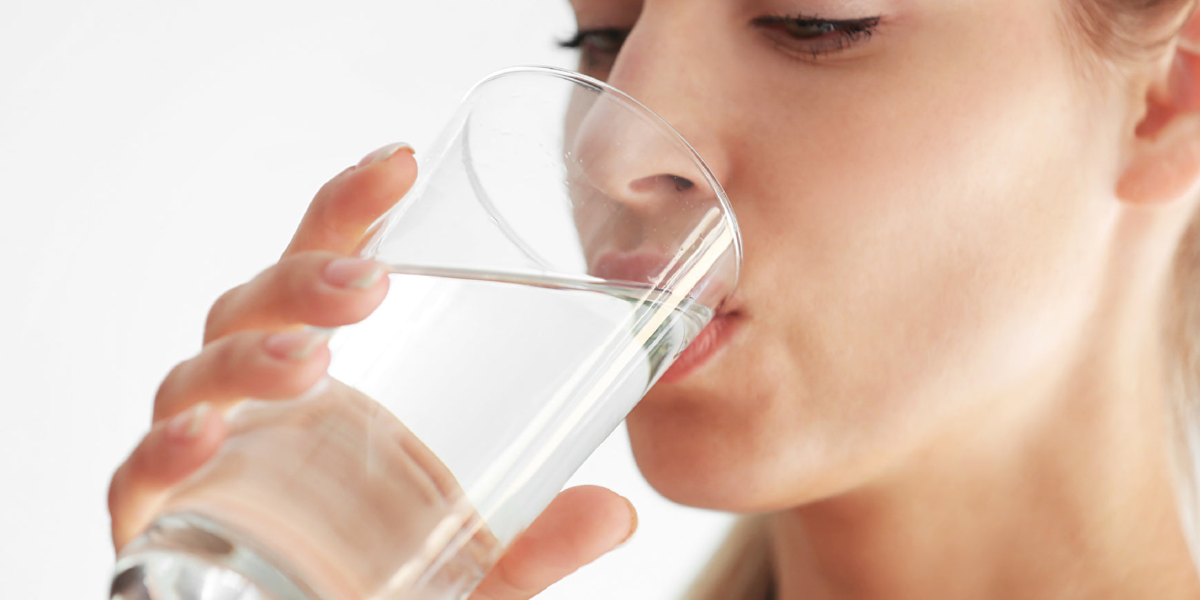 Woman drinking glass of water