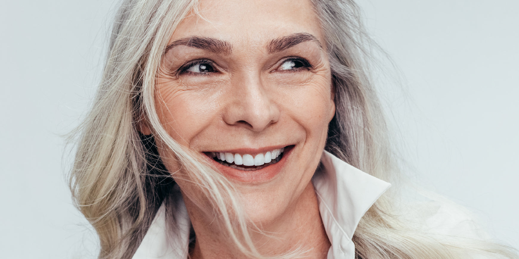 Mature woman smiling with teeth
