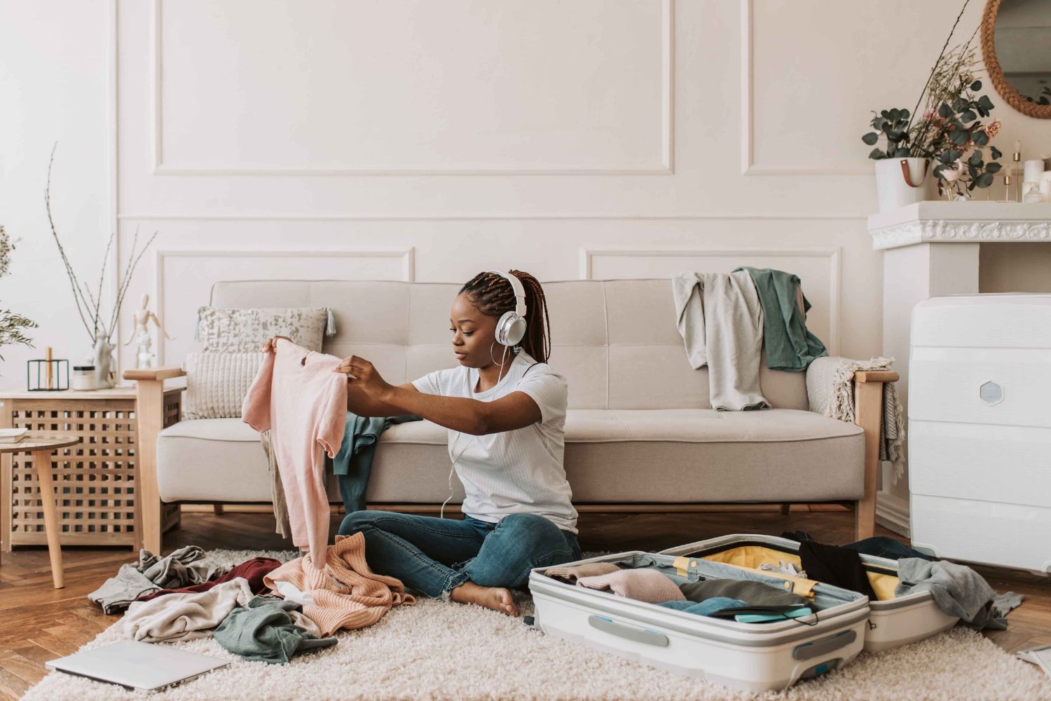 Woman sitting in the living room packing