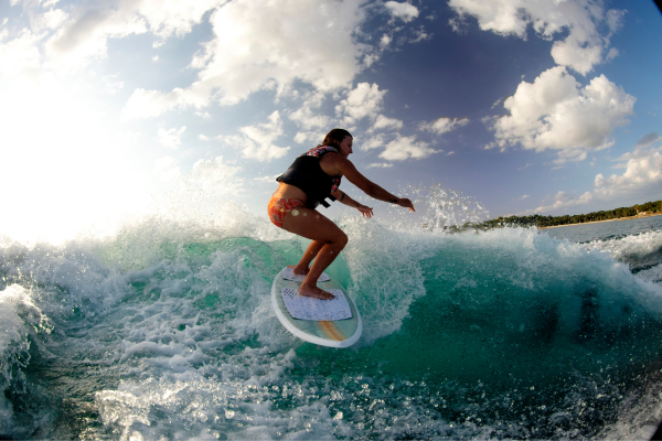 Woman riding a Ronix Koal Fish wakesurf board