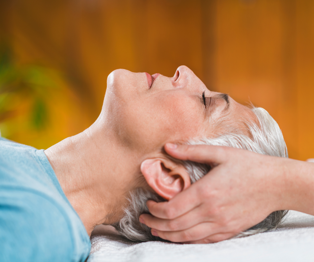  A woman smelling Ayurvedic oil 