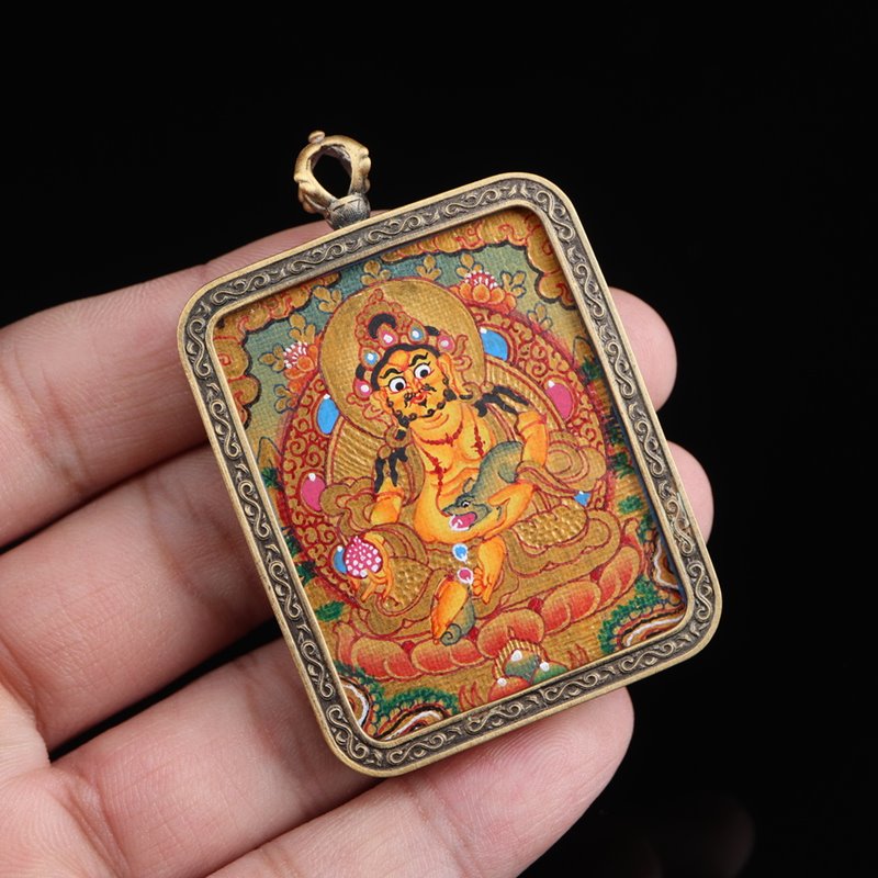 Dzambhala Thangka: Tibetan Painted Thangka Pendant - Mantrapiece.com