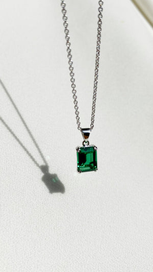 14k White Gold Oval Shaped Genuine .64 Cttw Emerald & Diamond Halo Pendant  – Exeter Jewelers