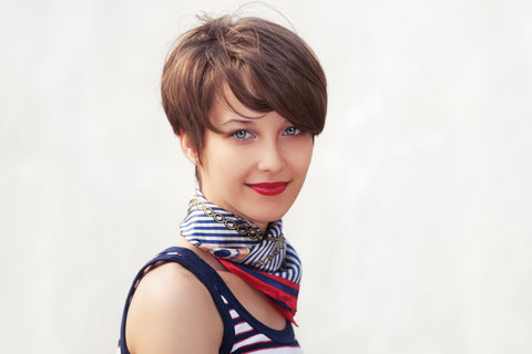A pixie cut on a round face