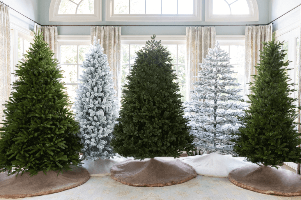 Five beautiful Christmas trees decorated with lights and ornaments