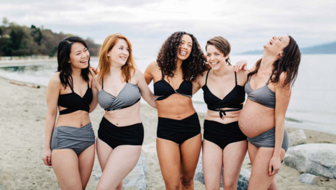 Five women in Nettle’s Tale Swimwear on a beach in Vancouver