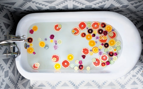 Bath tube filled with orange and lemon slices, 