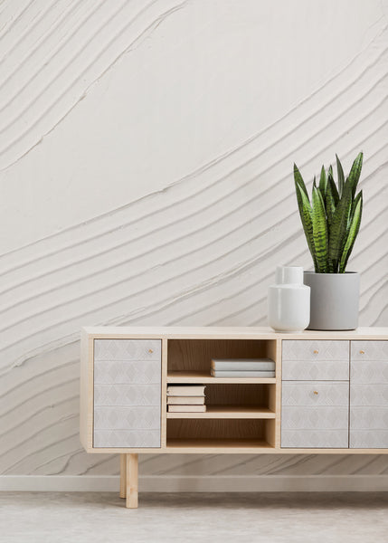 Room interior with a credenza decorated with wallpaper