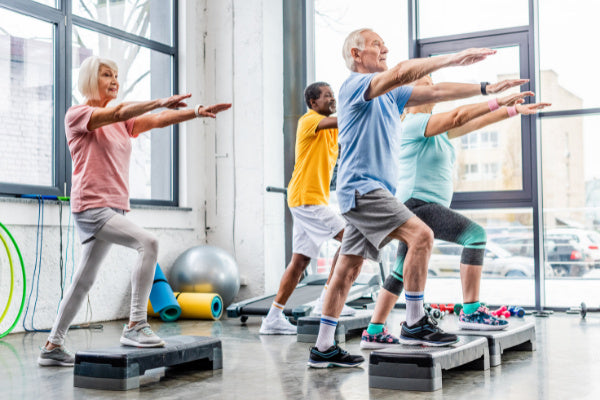 5 ways to deal with fatigue when you have chronic pain group of elderly people exercising at gym