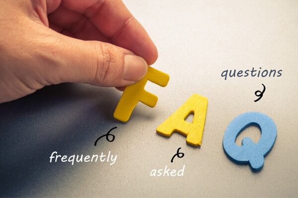 9 faqs about inflammation person putting wooden letters on table close up