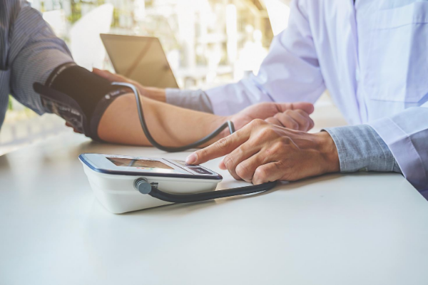 Doctor taking blood pressure